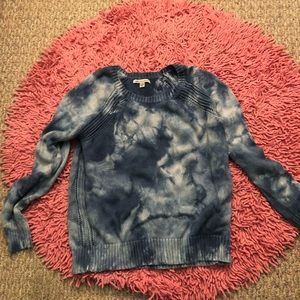 a bunch of shirts and sweaters